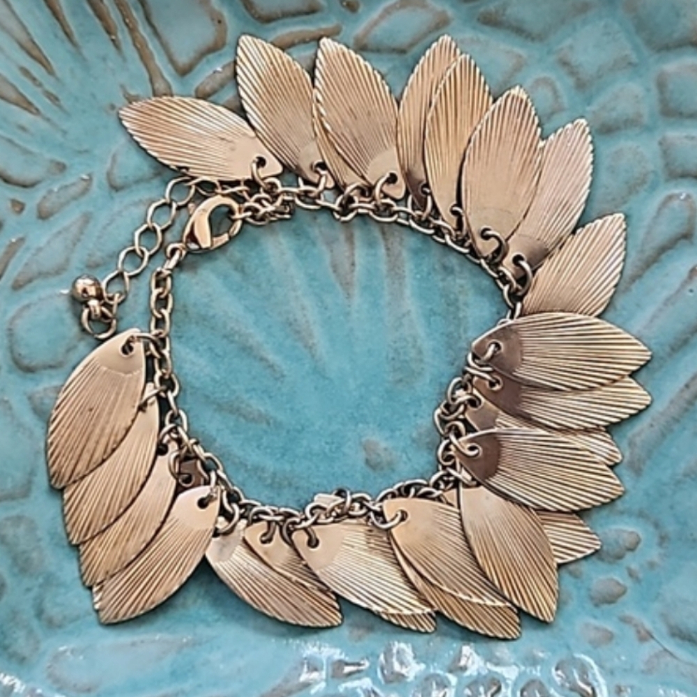 1/$5 or 3/$10 Vintage Gold-toned Feather/ Leaf Bracelet with lobster claw clasp.